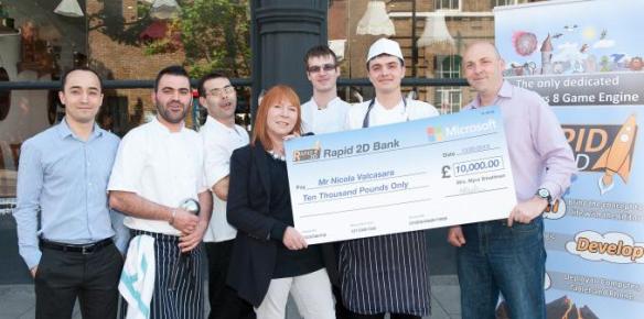 Myra and Andrew presenting the cheque